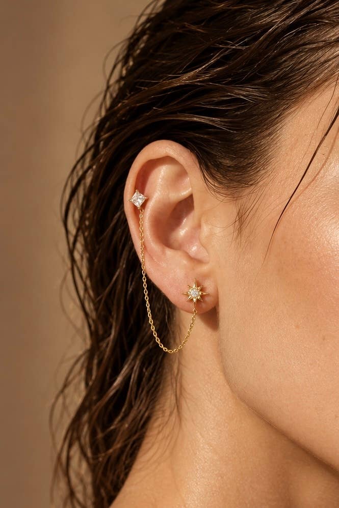Mono-boucle double piercing étoile en acier 124AQ806